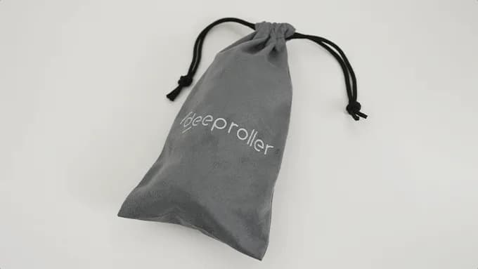 The Travel Roller carry case, a gray drawstring bag with the DeepRoller logo
